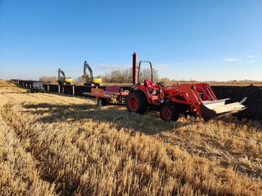 tractor with wooden posts for fencing